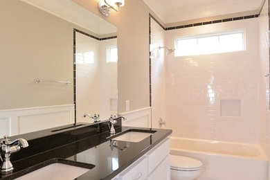 Example of a mid-sized arts and crafts master white tile and ceramic tile ceramic tile bathroom design in Nashville with an undermount sink, shaker cabinets, white cabinets and beige walls
