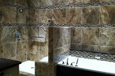 Example of a large transitional master brown tile and porcelain tile bathroom design in Little Rock with brown walls and granite countertops