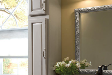 Tall pale bathroom cabinets with mantle covering