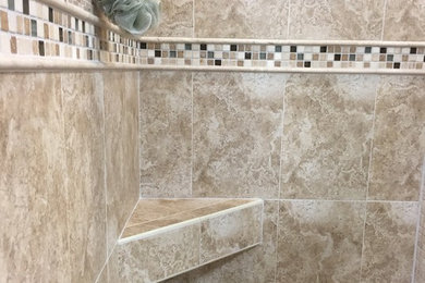 Example of a mid-sized classic master mosaic tile floor corner shower design in Chicago with beige walls