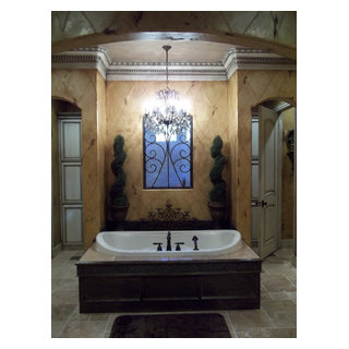 Tarnished metal and gold wall finish with hand designed embossed fleur