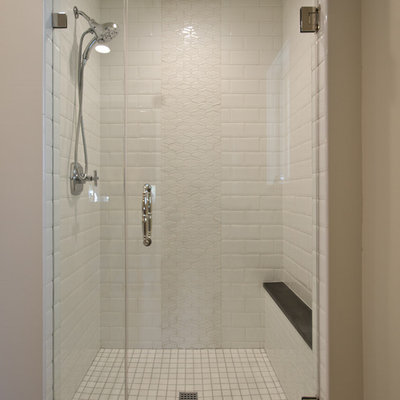 Example of a mid-sized classic 3/4 white tile and subway tile concrete floor and gray floor bathroom design in Phoenix with recessed-panel cabinets, white cabinets, gray walls, an undermount sink, quartz countertops and a hinged shower door