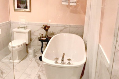 Photo of a small romantic ensuite bathroom in Other with a freestanding bath, yellow walls, marble flooring and white floors.