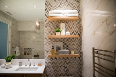 Small trendy master double-sink bathroom photo in Vancouver with flat-panel cabinets, medium tone wood cabinets and a floating vanity