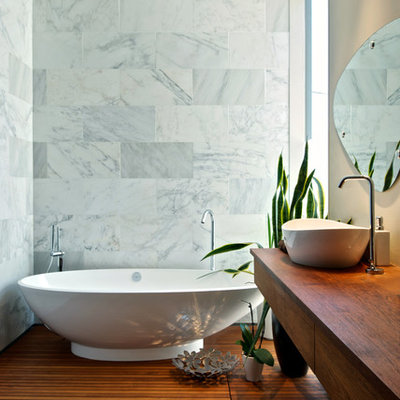 Bathroom - contemporary bathroom idea in Toronto with a vessel sink, wood countertops and brown countertops