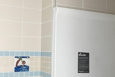 Bathroom - beige tile and porcelain tile bathroom idea in Houston