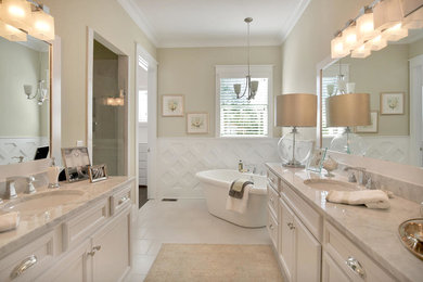 Example of a mid-sized classic master white tile bathroom design in Richmond with an undermount sink, raised-panel cabinets, white cabinets, a one-piece toilet and beige walls
