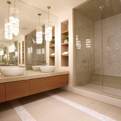 Bathroom - contemporary master beige tile bathroom idea in Toronto with a vessel sink, flat-panel cabinets and medium tone wood cabinets