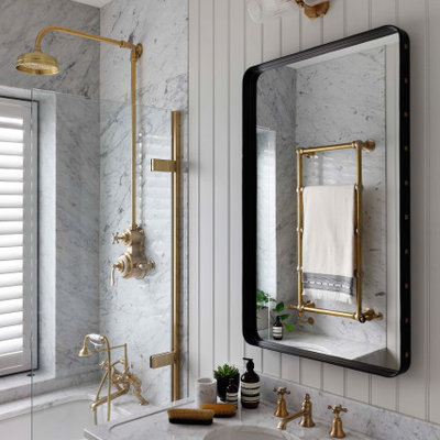 Inspiration for a mid-sized transitional 3/4 gray tile wall paneling tub/shower combo remodel in London with an undermount tub, gray walls, a console sink and gray countertops