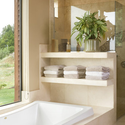 Inspiration for a large contemporary beige tile travertine floor bathroom remodel in Portland with beige walls