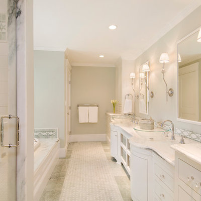 Elegant white tile bathroom photo in Boston with a vessel sink, white cabinets, flat-panel cabinets and white countertops