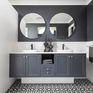 Inspiration for a wet room bathroom in Perth with recessed-panel cabinets, black cabinets, black walls, a vessel sink, multi-coloured floor, an open shower and white benchtops.