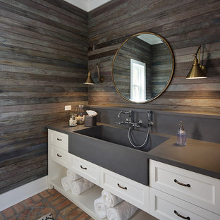 Inspiration for a country 3/4 bathroom in Milwaukee with recessed-panel cabinets, white cabinets, brown walls, brick floors, an integrated sink, red floor and grey benchtops.