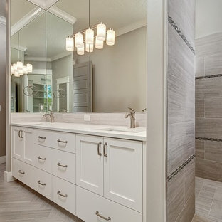 Example of a large arts and crafts 3/4 gray tile and porcelain tile porcelain tile doorless shower design in Boise with shaker cabinets, white cabinets, gray walls, an undermount sink and quartz countertops