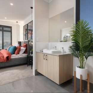 Mid-sized contemporary 3/4 bathroom in Perth with flat-panel cabinets, beige cabinets, beige walls, porcelain floors, a vessel sink, grey floor and grey benchtops.