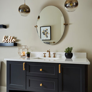 Inspiration for a large country 3/4 bathroom in Minneapolis with recessed-panel cabinets, black cabinets, a two-piece toilet, black and white tile, porcelain tile, brick floors, an undermount sink, engineered quartz benchtops, white floor and beige walls.