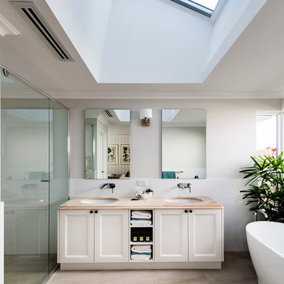 Freestanding bathtub - large traditional master freestanding bathtub idea in Perth with an undermount sink, recessed-panel cabinets, white cabinets and white walls