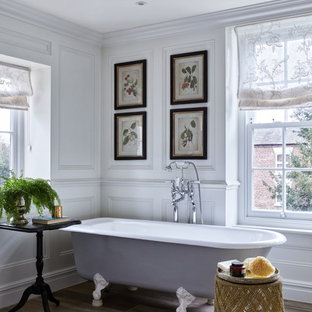 Inspiration for a traditional bathroom in Brisbane with a claw-foot tub, white walls and brown floor.