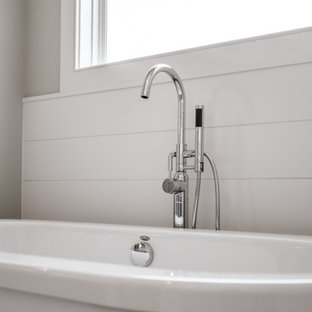 Farmhouse master ceramic tile, brown floor, double-sink and shiplap wall bathroom photo in Louisville with gray cabinets, gray walls, a drop-in sink, granite countertops, a hinged shower door, white countertops and a built-in vanity