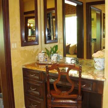The Rubin-Onyx counter top in "her" dressing area with Woodmode cabinetry