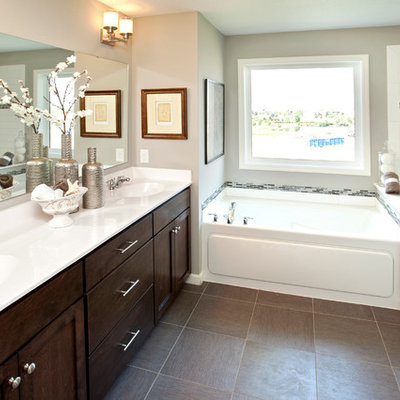 Example of a classic brown tile bathroom design in Minneapolis with an integrated sink, shaker cabinets and dark wood cabinets