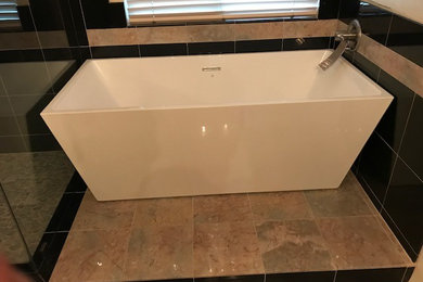 Example of a huge trendy master freestanding bathtub design in Phoenix