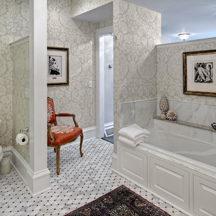 Example of a mid-sized classic master mosaic tile marble floor alcove bathtub design in Minneapolis with multicolored walls and a two-piece toilet