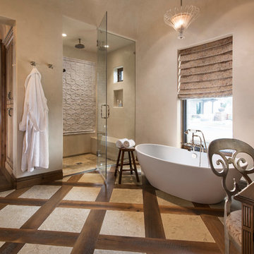 This bathroom combines reclaimed wood and limestone flooring in a pattern, and f