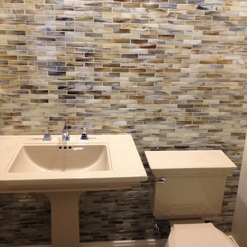 This is a Kohler Memoirs pedestal lavatory, faucet, and toilet in their Sand col