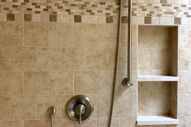 Inspiration for a mid-sized transitional master ceramic tile ceramic tile corner shower remodel in Seattle with a hinged shower door