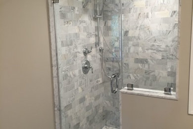 Inspiration for a small transitional master gray tile and stone tile ceramic tile corner shower remodel in Philadelphia with a trough sink, shaker cabinets, white cabinets, marble countertops, a two-piece toilet and beige walls
