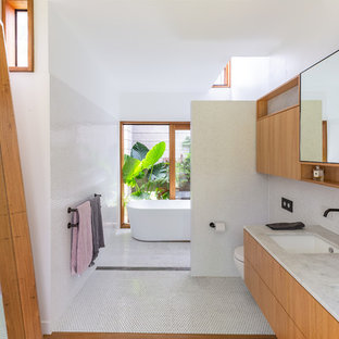 Modern master bathroom in Gold Coast - Tweed with flat-panel cabinets, medium wood cabinets, a freestanding tub, an open shower, white tile, mosaic tile, white walls, medium hardwood floors, an undermount sink, brown floor, an open shower and grey benchtops.