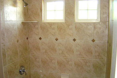 Inspiration for a large timeless master beige tile and ceramic tile alcove shower remodel in Denver with beige walls