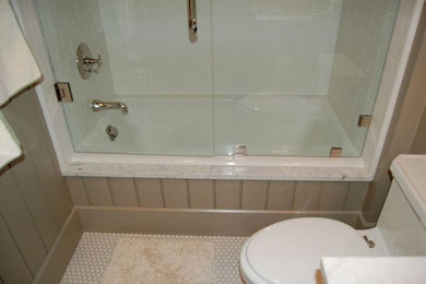 Design ideas for a classic bathroom in Other with white tiles and beige walls.