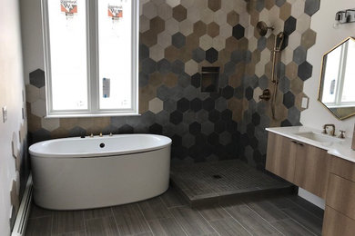 Design ideas for a medium sized contemporary ensuite bathroom in Denver with flat-panel cabinets, dark wood cabinets, a freestanding bath, a corner shower, multi-coloured tiles, mosaic tiles, white walls, porcelain flooring, a submerged sink, engineered stone worktops, brown floors, an open shower and white worktops.