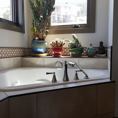 Inspiration for a contemporary corner bathtub remodel in Other