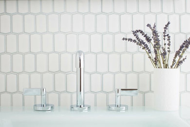 Mid-sized danish 3/4 white tile and porcelain tile bathroom photo in Louisville with white walls and an integrated sink