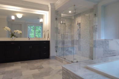 Design ideas for a medium sized classic ensuite bathroom in DC Metro with flat-panel cabinets, black cabinets, a built-in bath, a corner shower, grey tiles, white tiles, marble tiles, white walls, marble flooring, a submerged sink, engineered stone worktops, grey floors and a hinged door.