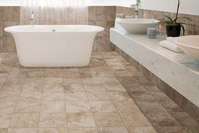 Large trendy master beige tile and stone tile ceramic tile freestanding bathtub photo in Milwaukee with open cabinets, white walls and a vessel sink