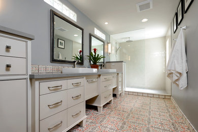 Large transitional master multicolored tile and terra-cotta tile terra-cotta tile alcove shower photo in Phoenix with beaded inset cabinets, beige cabinets, gray walls, a vessel sink and quartz countertops