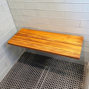 Tiled shower with teak bench