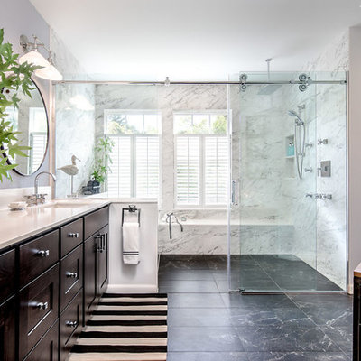 Bathroom - large contemporary master marble floor and black floor bathroom idea in Seattle with recessed-panel cabinets, dark wood cabinets, quartz countertops, white countertops, gray walls and an undermount sink