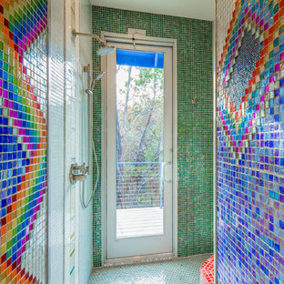 Inspiration for a mid-sized eclectic multicolored tile and glass tile ceramic tile doorless shower remodel in Austin with flat-panel cabinets, white cabinets, a one-piece toilet and multicolored walls