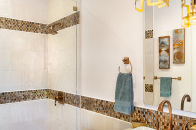 Small transitional 3/4 multicolored tile and glass tile bathroom photo in Phoenix with raised-panel cabinets, brown cabinets and quartz countertops