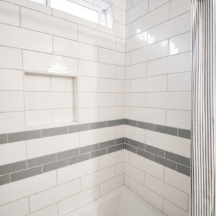 This is an example of a small modern 3/4 bathroom in Portland with flat-panel cabinets, light wood cabinets, a shower/bathtub combo, a two-piece toilet, white tile, subway tile, beige walls, cork floors, an undermount sink, engineered quartz benchtops, red floor, a shower curtain, white benchtops, a niche, a single vanity and a built-in vanity.