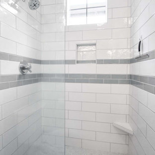This is an example of a small modern 3/4 bathroom in Portland with flat-panel cabinets, light wood cabinets, an alcove shower, a two-piece toilet, white tile, subway tile, beige walls, cork floors, an undermount sink, engineered quartz benchtops, red floor, a hinged shower door, white benchtops, a niche, a double vanity and a built-in vanity.