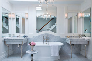Inspiration for a victorian white tile and stone slab freestanding bathtub remodel in Boston with an undermount sink and white walls