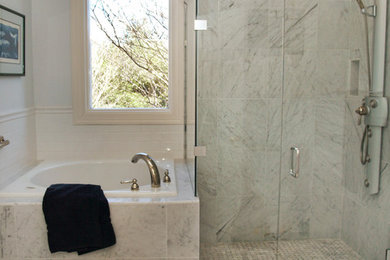 Mid-sized elegant master gray tile and marble tile marble floor bathroom photo in Austin with white cabinets, white walls, marble countertops, raised-panel cabinets and a drop-in sink