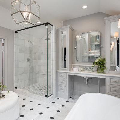 Example of a large classic master black and white tile and stone tile marble floor bathroom design in Other with gray cabinets, a one-piece toilet, gray walls, an undermount sink, marble countertops and raised-panel cabinets