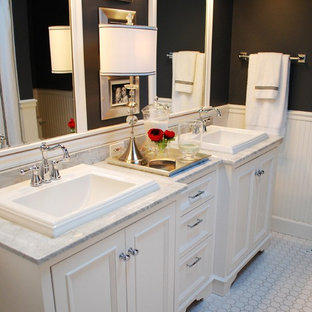 Bathroom - traditional mosaic tile bathroom idea in Boise with a drop-in sink and black walls